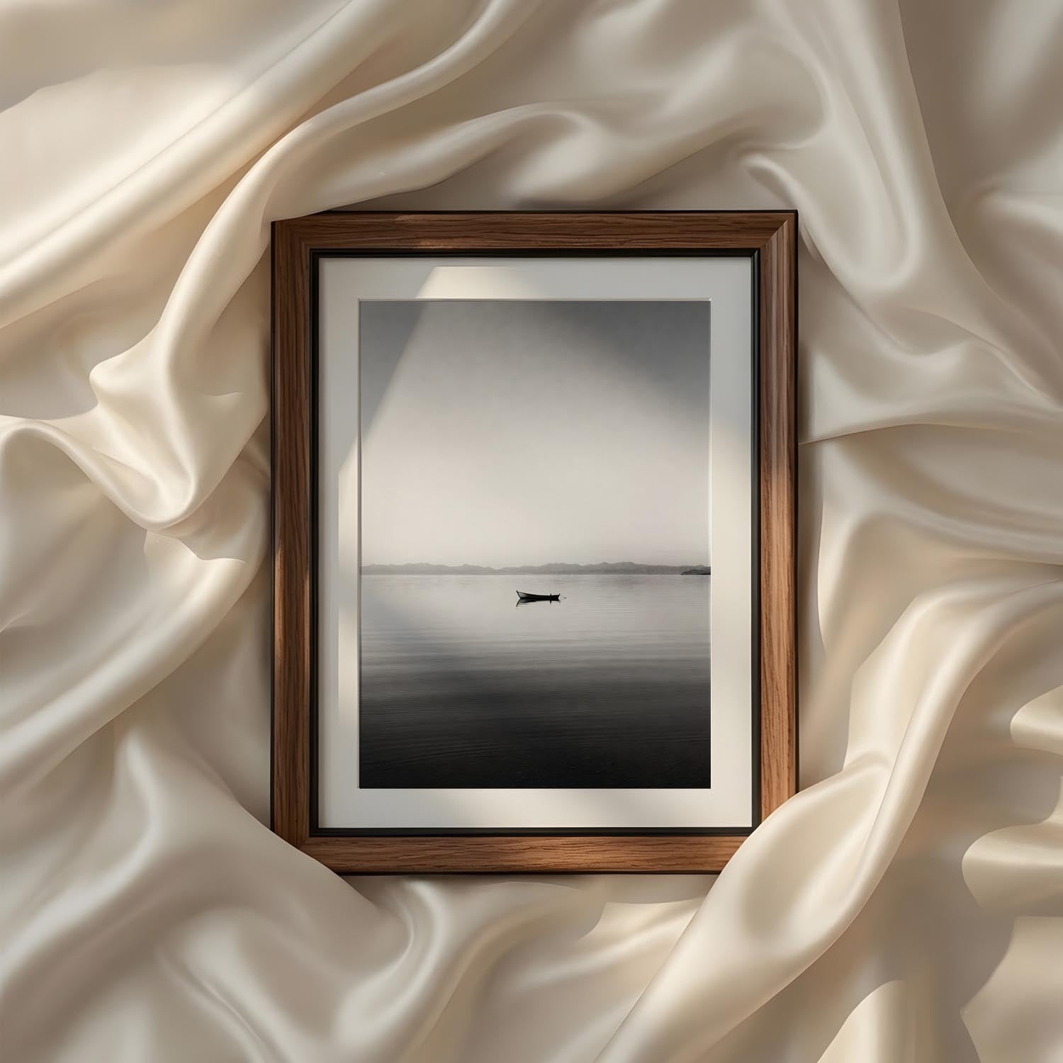 Minimalist black and white lake photography featuring a solitary boat on calm water, printable fine art wall decor for modern living rooms, bedrooms, and peaceful interiors.