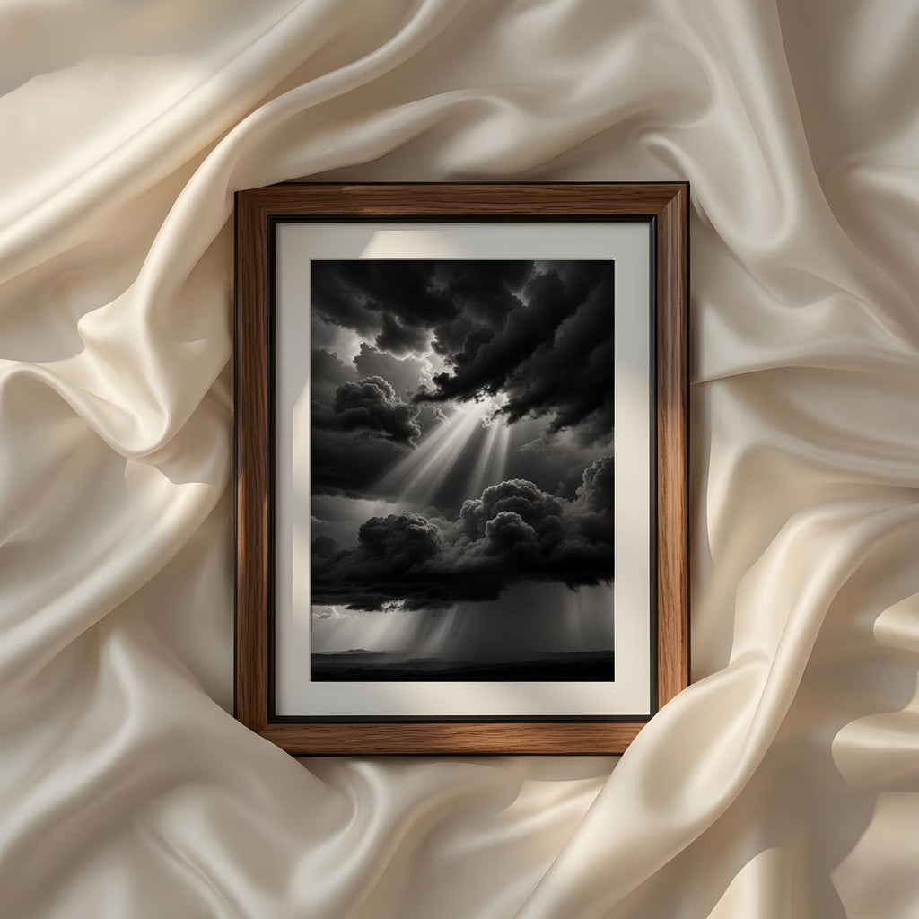 Powerful monochrome landscape photography showcasing dramatic storm clouds and radiant sunbeams, printable black and white wall art for sophisticated modern interiors.