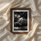 Powerful monochrome landscape photography showcasing dramatic storm clouds and radiant sunbeams, printable black and white wall art for sophisticated modern interiors.