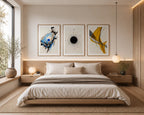 Contemporary Watercolor Abstract Set of 3 by iArt Tech Studio featured in a luxurious contemporary bedroom inside a modern American home. The abstract watercolor triptych is framed in premium oak wood with oversized white matting and centered above the upholstered headboard. Warm natural daylight fills the room, highlighting elegant bedding, wood nightstands, sculptural lighting, and minimalist décor.