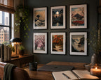 Six Japanese printable wall art prints arranged as a gallery wall in a stylish modern home office with dark walls, black frames, white matting, indoor plants, wood furniture, and cozy workspace decor overlooking the city skyline.